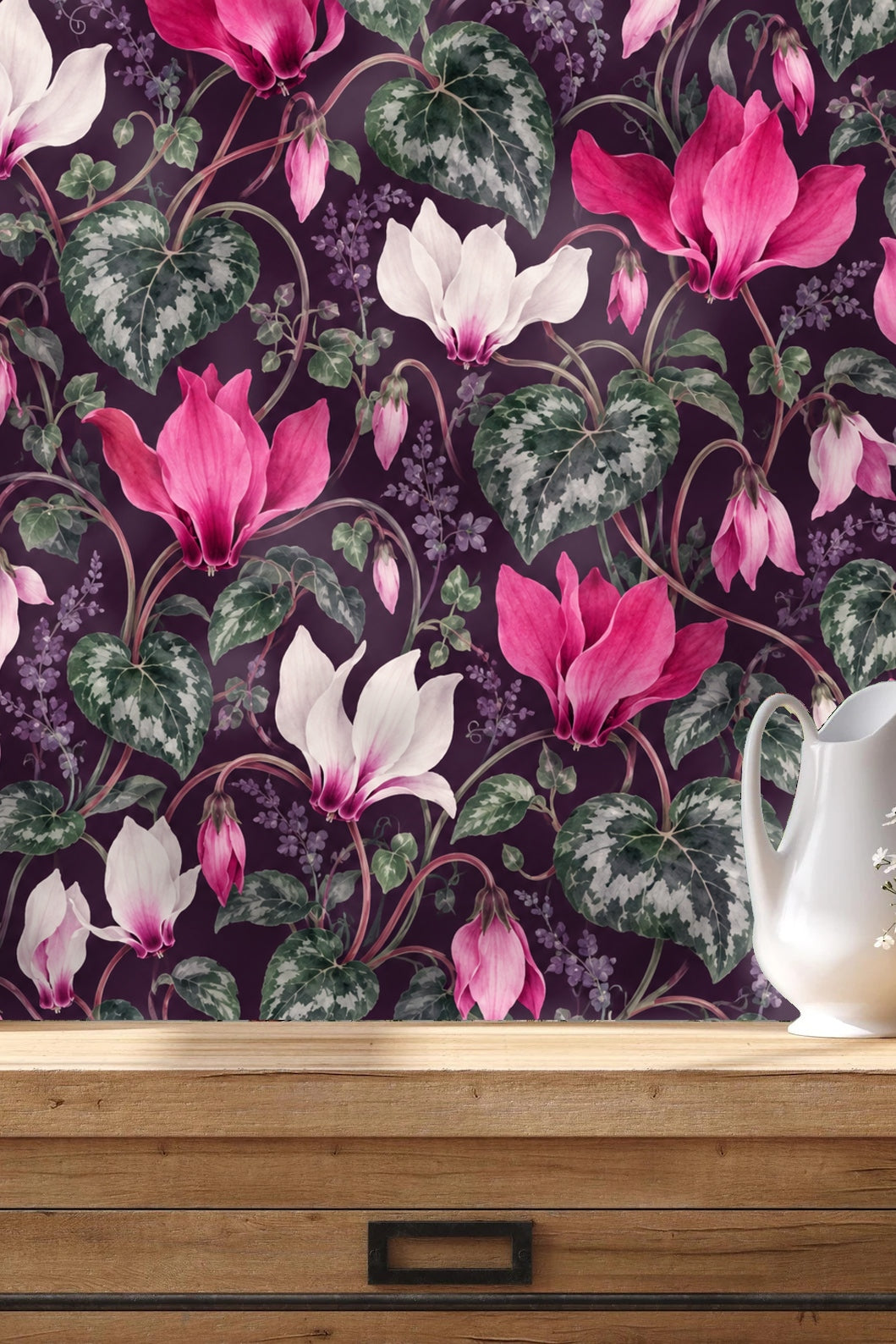 Side view of woven leather chair in front of floral wallpaper