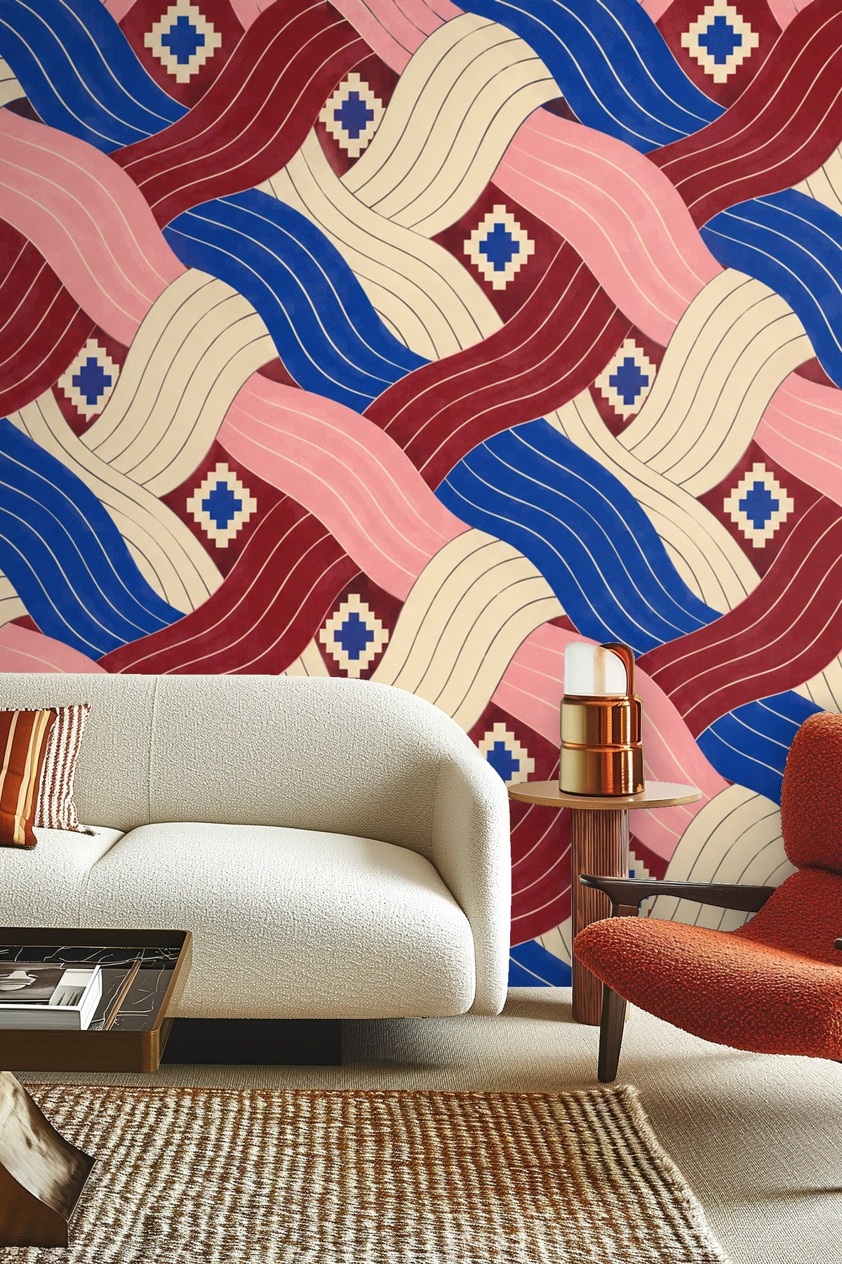 Living room wall with cobalt pleated current wallpaper behind gray sofa with green and cream pillows