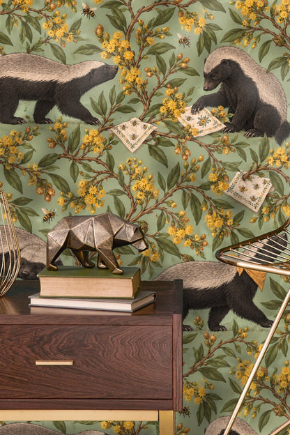 Honey badger sitting and holding an embroidered cloth with bees around