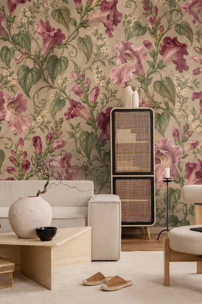 Children's playroom wall featuring Maurandya Rose Scroll wallpaper with a white playhouse and rattan furniture