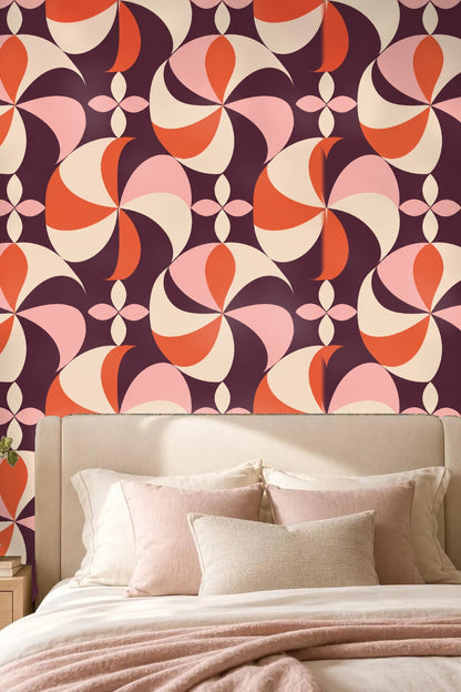 Close up on intersections of pinwheel petals in vibrant plum and coral hues
