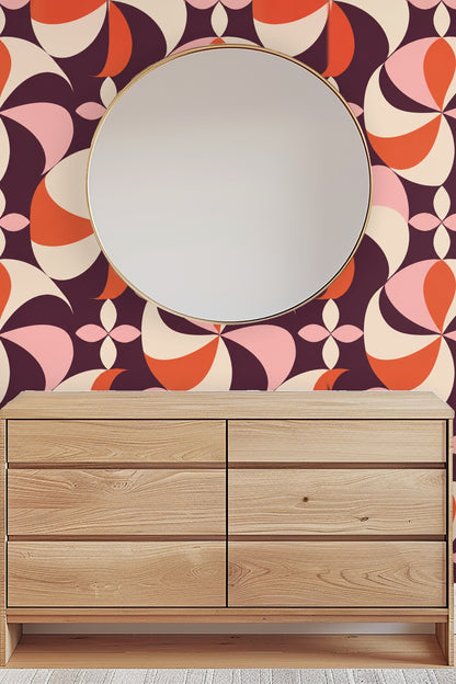 Visual focus on wallpaper's repeated pinwheel motif in a warm color palette