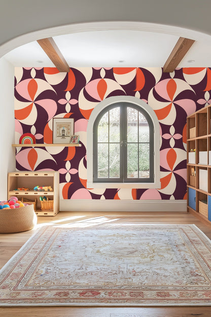 Textured plaster walls framing area with Plum Pinwheel wallpaper and a circular mirror