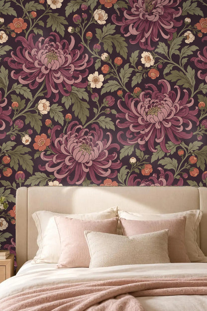 Wallpaper pattern with deep plum chrysanthemums and green leaves on a dark background.