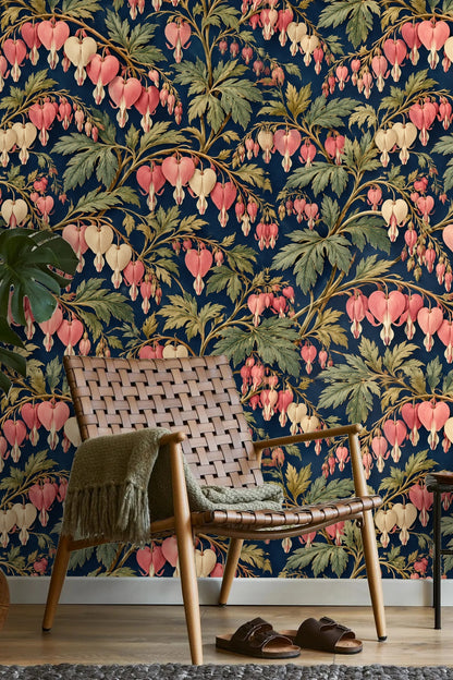 Close-up of dicentra flower cluster in coral and cream tones on navy wallpaper