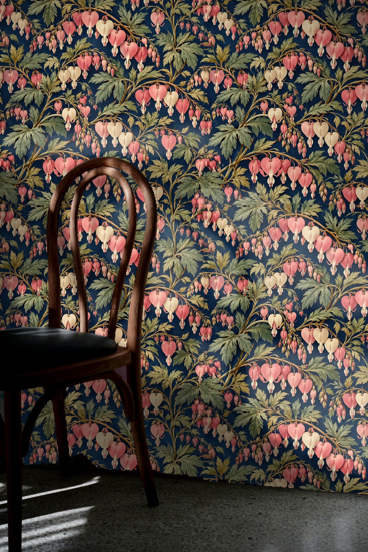 Overhead look at wallpaper sample sheet with dicentra motif and ruler