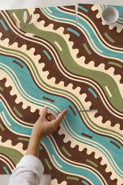 Partial view of wallpaper pattern focusing on blue and green waves with textured wood grain effect