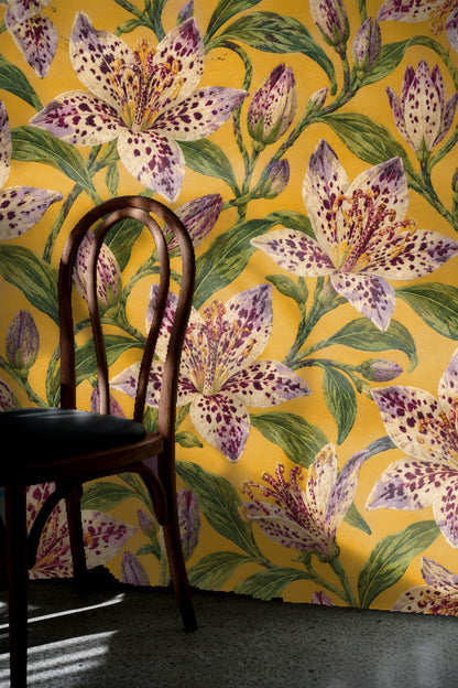 Wallpaper pattern detail focusing on speckled petals of tricyrtis lilies and lush green leaves