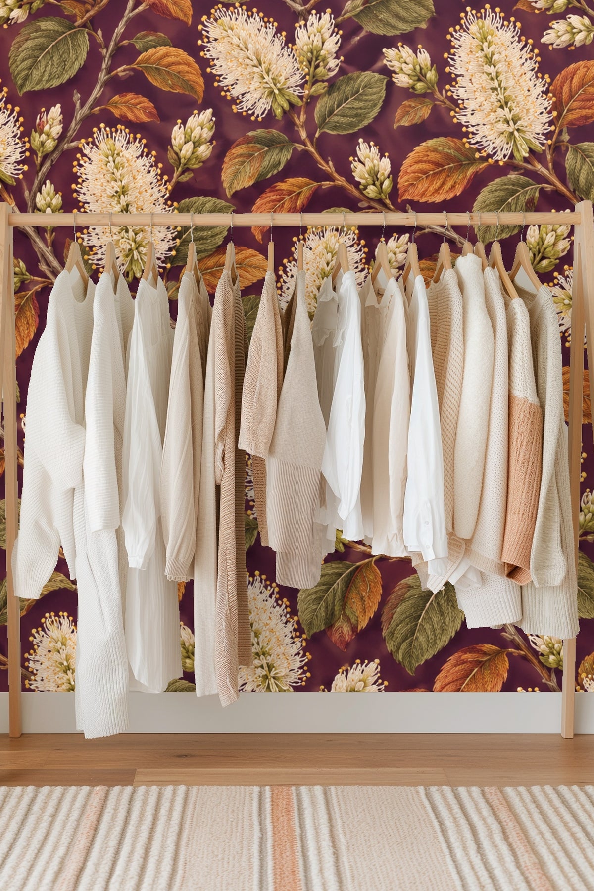 Textured leaves and detailed florals on plum background in botanical repeat pattern