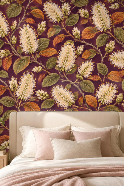 Laundry room featuring wallpaper with ivory bottlebrush blooms and botanicals on plum, accented by white appliances and oak shelving