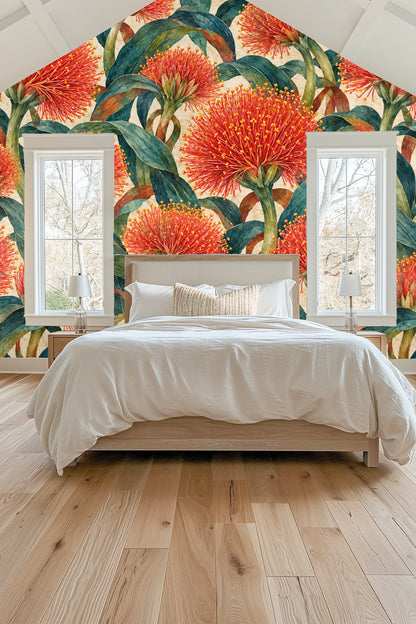 Living room with orange sofa and fiery red scadoxus floral wallpaper accent wall.