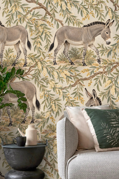 Living room scene with botanical wallpaper and emerald green cushions