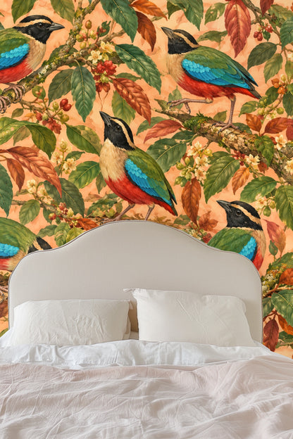 Ornithological wallpaper with colorful pitta birds and coffee-colored leaves.