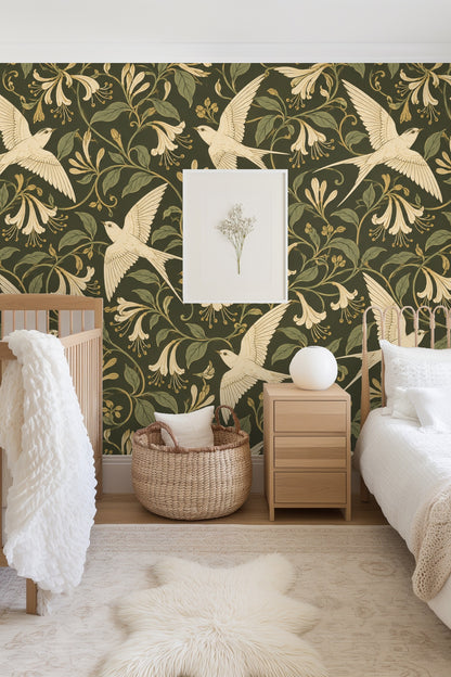 Muted green wallpaper with cream birds and floral elements creating soft natural look