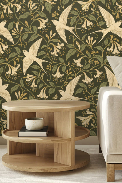 Close-up of Ivory Flight wallpaper behind three stuffed animals on a bench, highlighting the cream birds and floral pattern on olive green