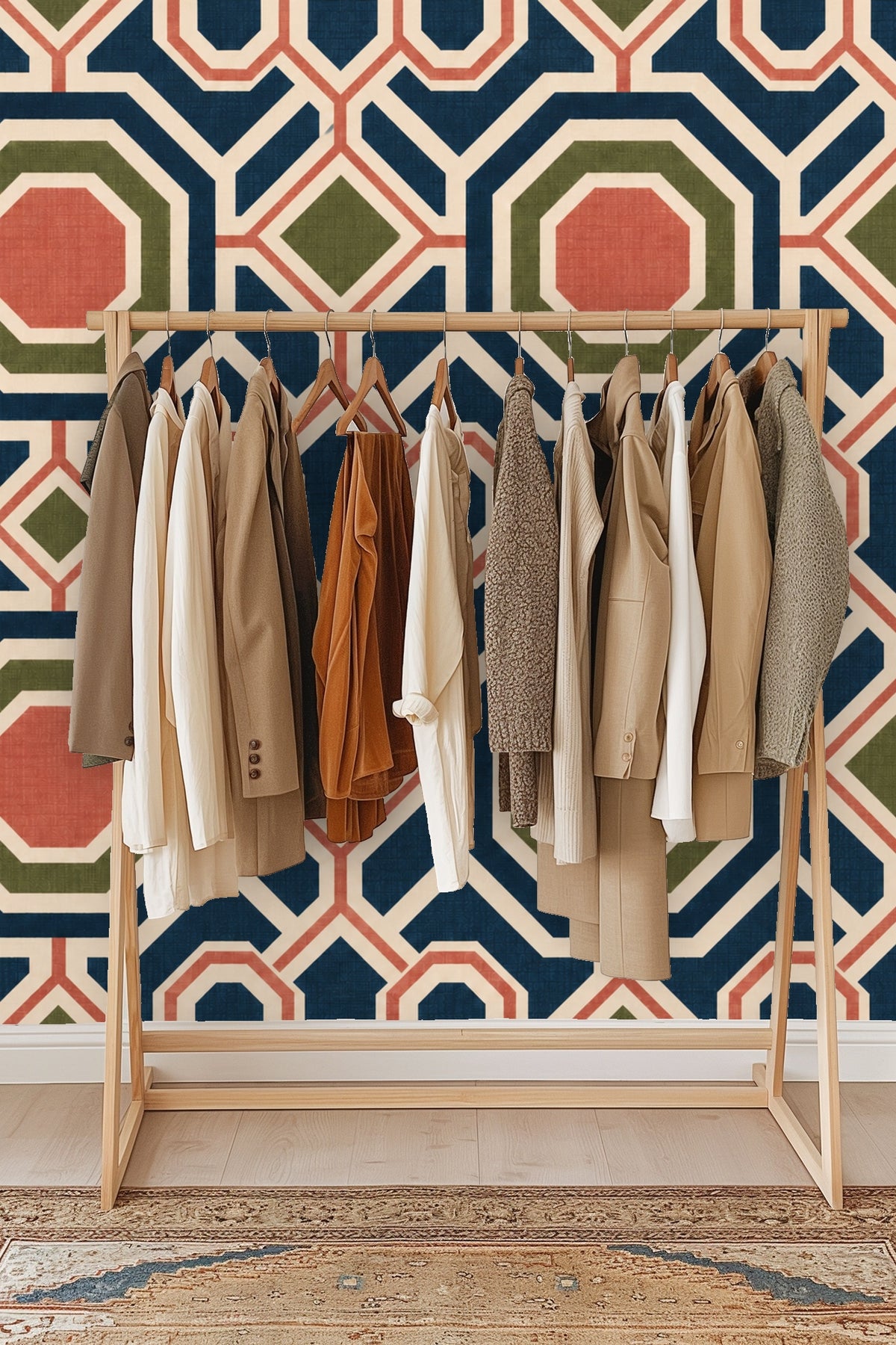 Wallpaper sample roll unrolled showing the navy, coral, and olive geometric design on cream background.