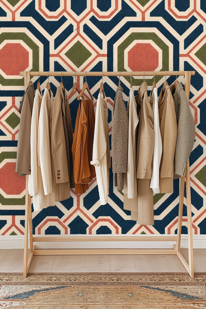 Wallpaper sample roll unrolled showing the navy, coral, and olive geometric design on cream background.
