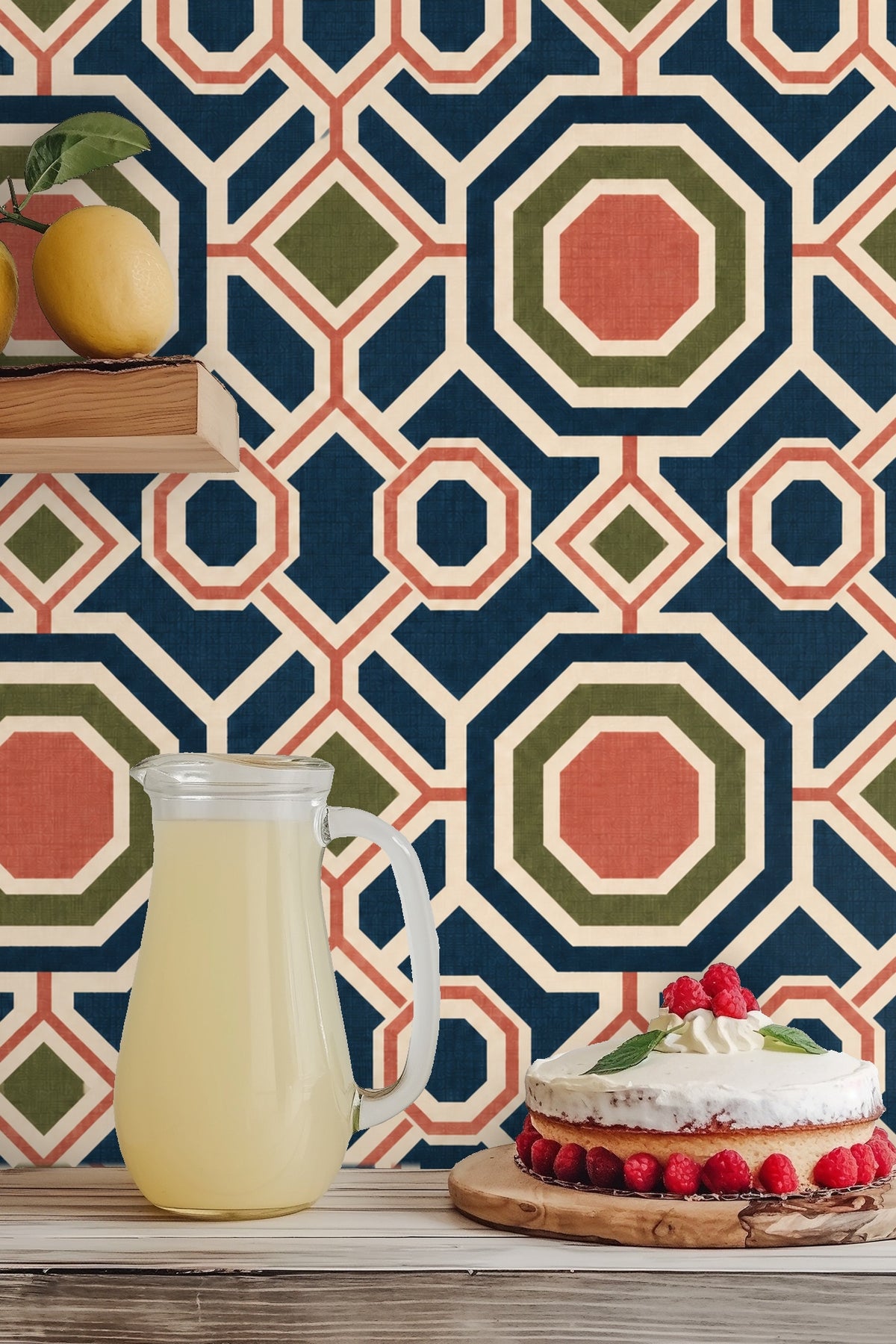 Wall with wallpaper showing large octagonal shapes in blue and coral with olive diamond points through a cozy interior.