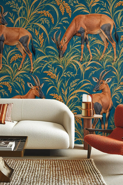 Wallpaper artwork featuring four topi antelopes standing and grazing among golden millet and tall grasses on a rich petrol blue background