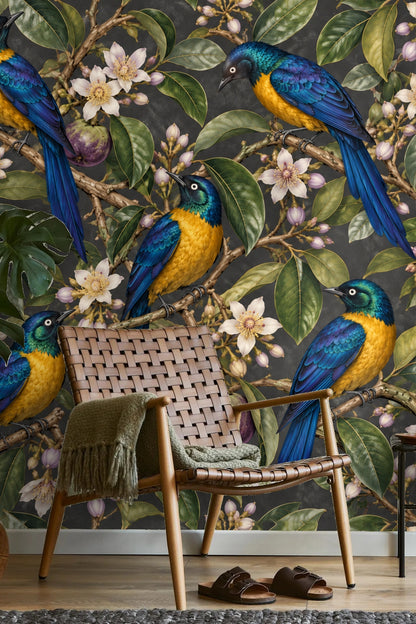 Purple starapple fruit nestled within green leaves framed by vibrant starlings