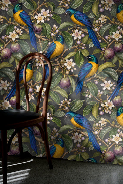 Wallpaper as backdrop to a neutral cushioned armchair with green leaf-patterned pillow