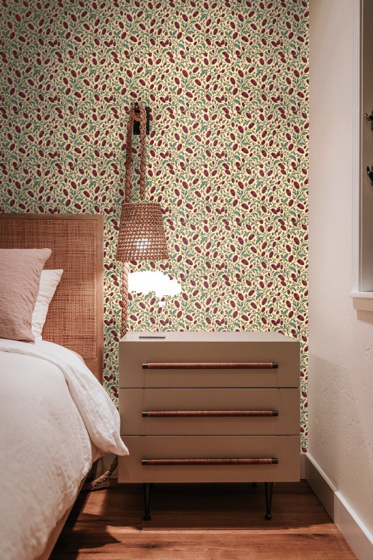 Wallpaper artwork showing garnet sanguisorba clusters with green leaves on a cream background