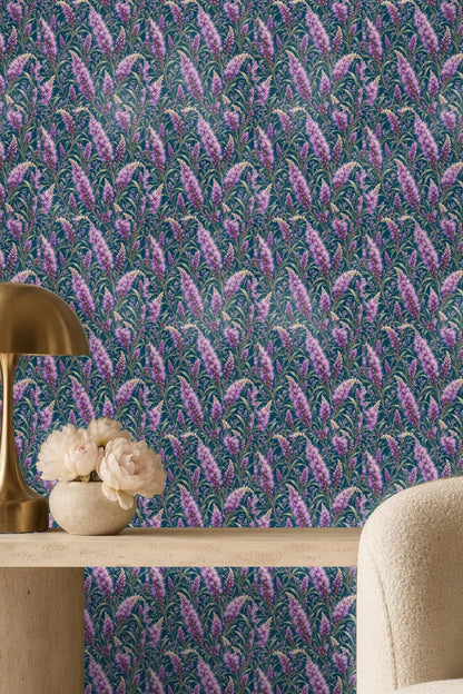 Decorative wallpaper with tall floral liatris spikes against rich blue backdrop.