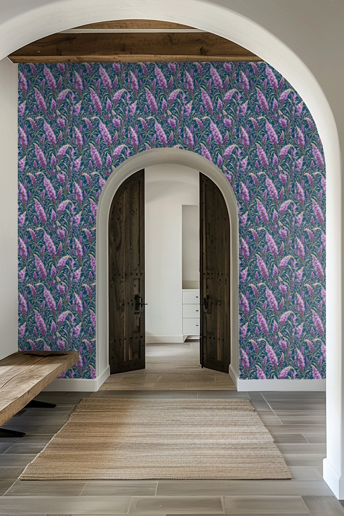 Bathroom wall section with Liatris Violet Sparks wallpaper seen behind a gold towel ring holding a white towel, highlighting the delicate, l