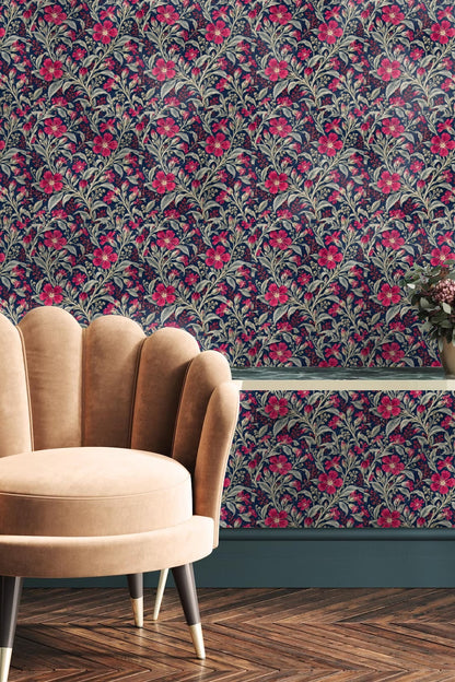 Wall with navy botanical wallpaper accented by wooden ladder and beige throw