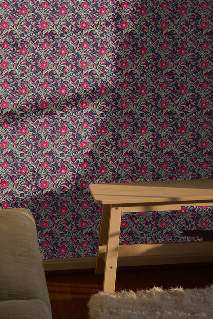 Floral wallpaper in a cozy room highlighting red and silver tones