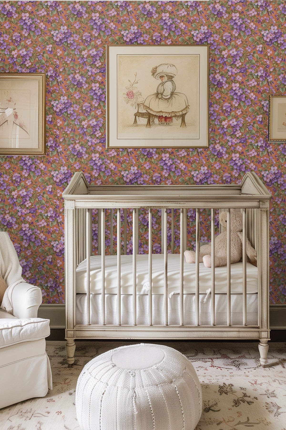 Bedroom wall covered in Aubrieta Violet Cascade wallpaper behind rattan headboard with green and white linens