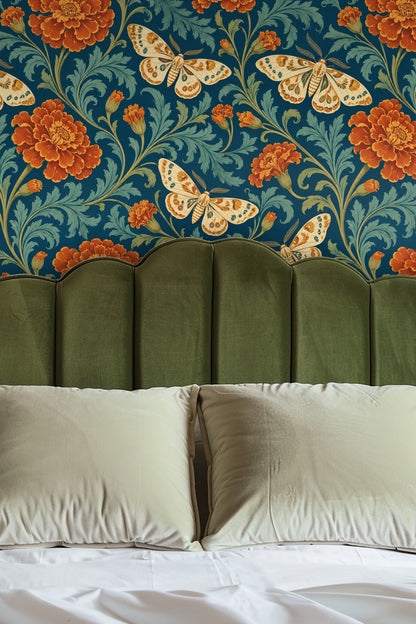 Pattern detail showing rust-orange marigold flowers and cream moths with teal accents on a deep teal background