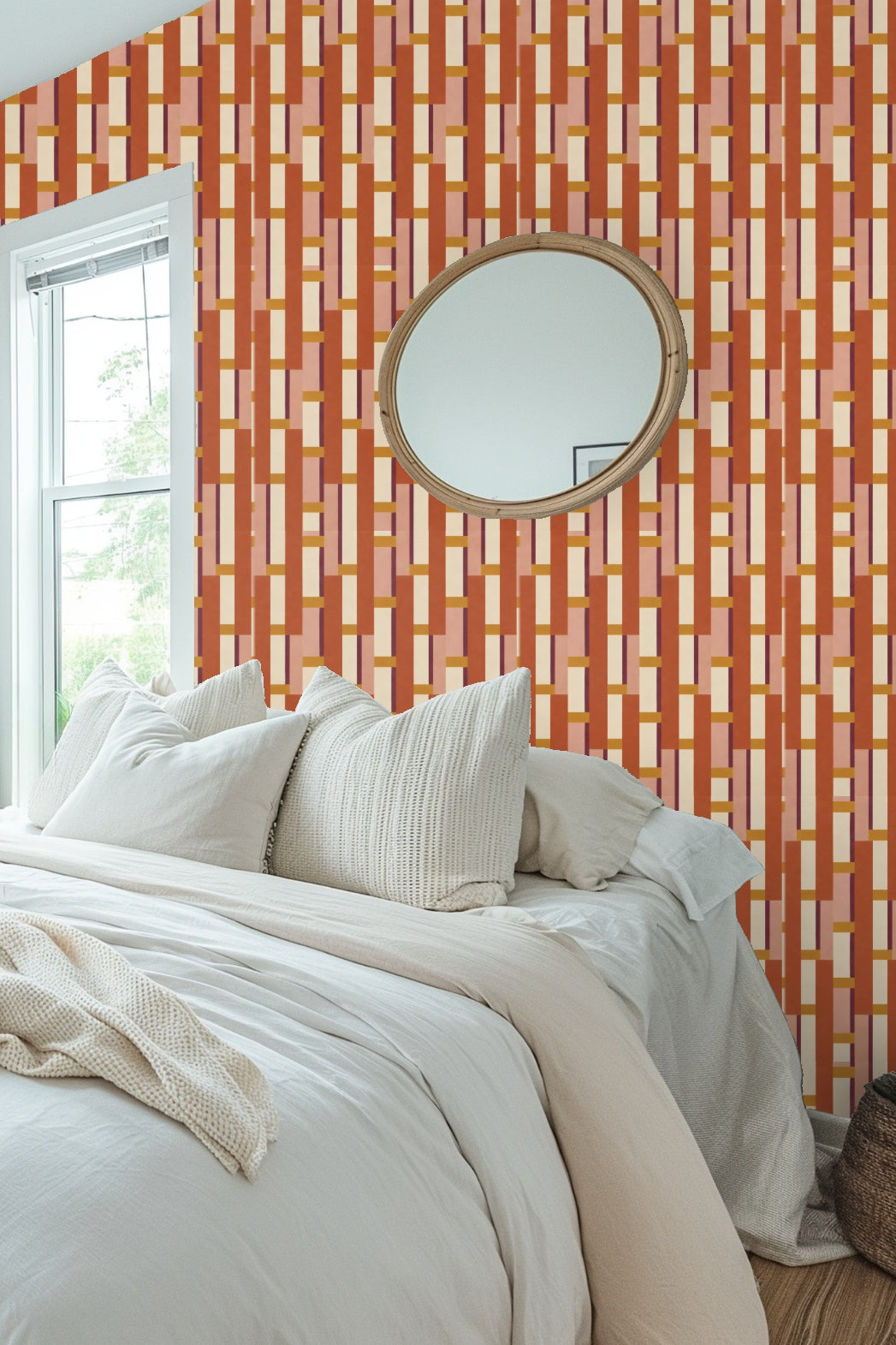 Bedroom with pink scallop headboard and Spice Ladder wallpaper in terracotta and ochre vertical block pattern.