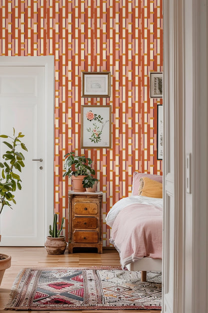 Wall segment showing repeating vertical blocks in terracotta, ochre, cream, pink, and maroon.