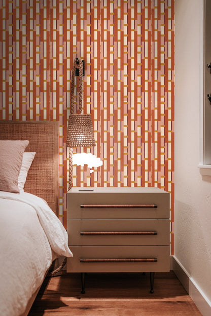 Light-filled room showcasing bold geometric wallpaper pattern in natural light.