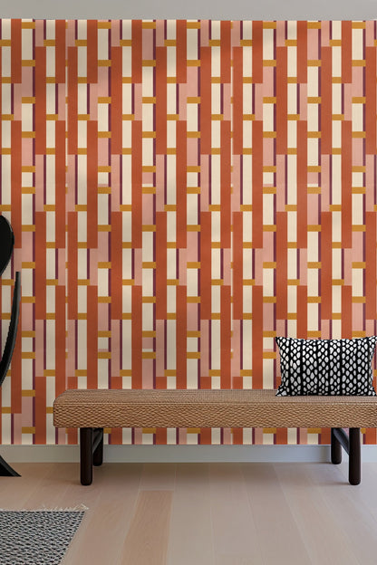 Detail close-up of geometric stacked block wallpaper with terracotta and ochre colors.
