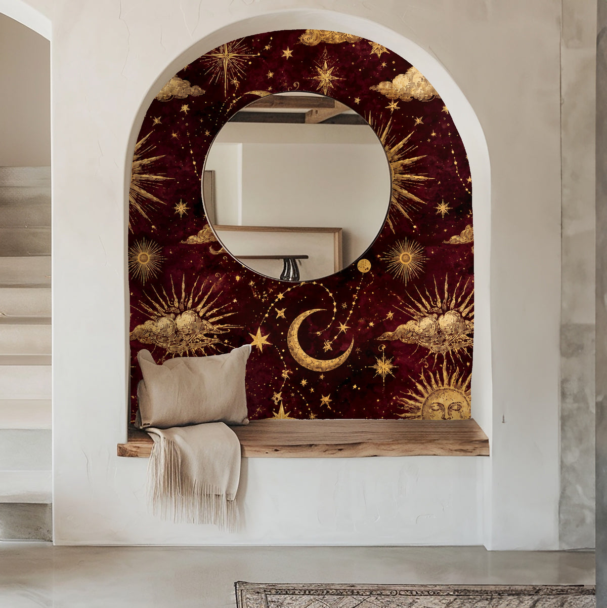 Bedroom headboard close-up showing gold sun motif and crescent moon on maroon wallpaper behind an olive-green upholstered headboard