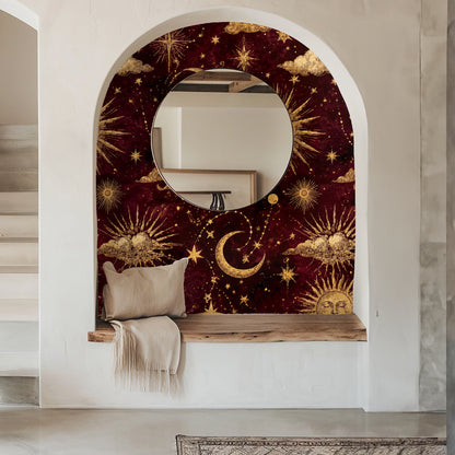 Bedroom headboard close-up showing gold sun motif and crescent moon on maroon wallpaper behind an olive-green upholstered headboard