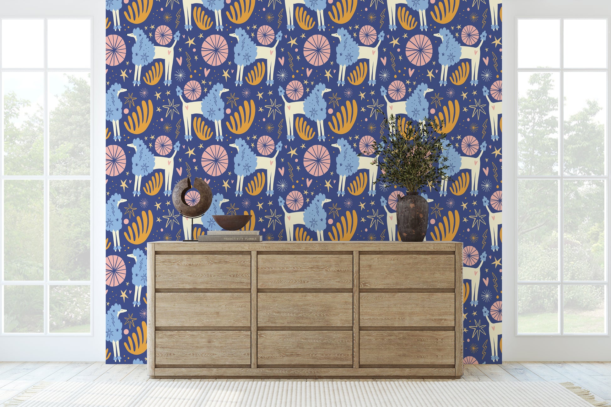 Close-up repeat pattern of Celestial Grove showing stylized llamas, starbursts, fans and hearts on an indigo background