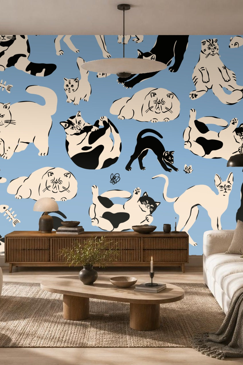 Cluster of various cat breeds illustrated in black and cream on blue ground
