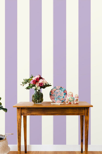 Wallpaper installed behind a modern sofa with purple cushions