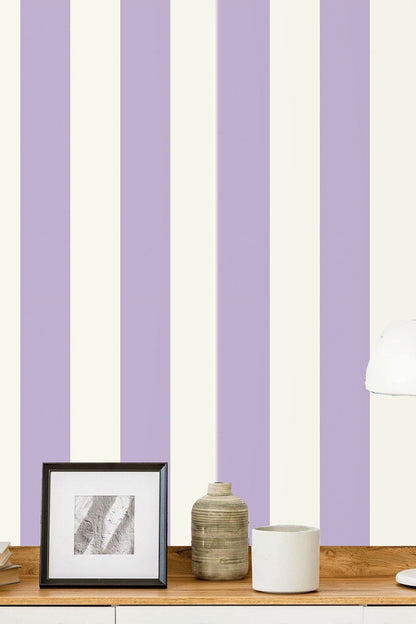 Bedroom corner with wooden furniture and lavender and ivory striped wallpaper