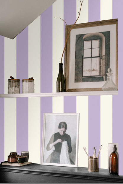 Wallpaper roll showing wide lavender and ivory stripes
