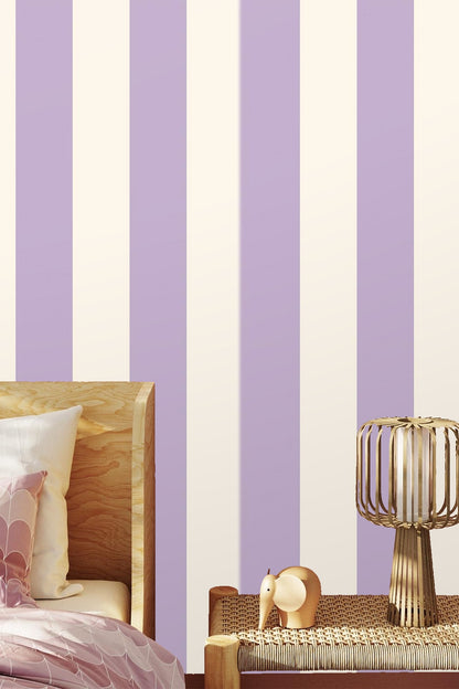 Living room with mauve sofa against lavender and ivory striped wall