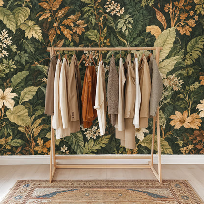 Tight detail of oversized tropical leaves and layered foliage in olive, sage and amber tones from the Codex Grove design.