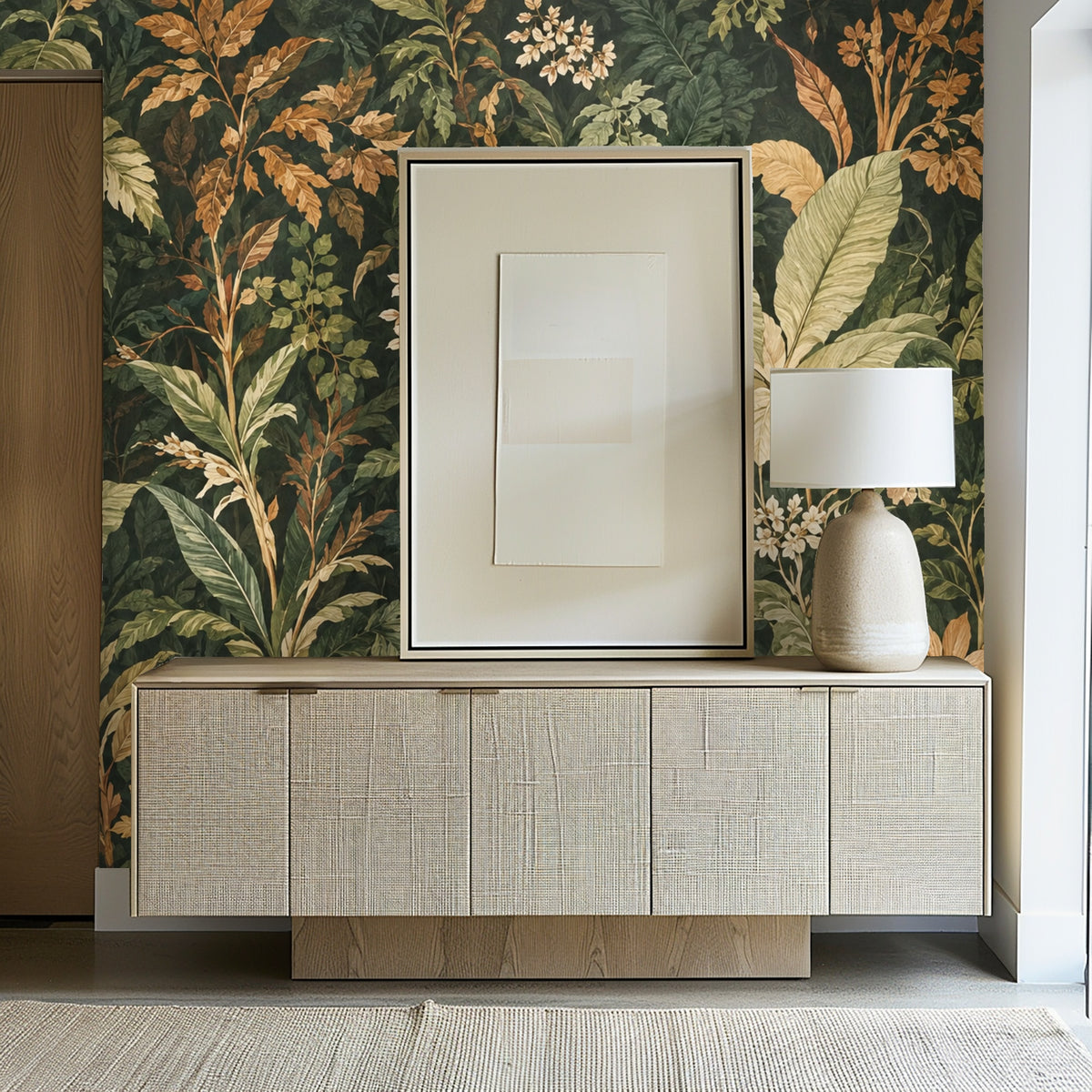 Bathroom detail with a brass towel ring and marble edge in front of Codex Grove wallpaper, showing scaled leaves and white blossoms.