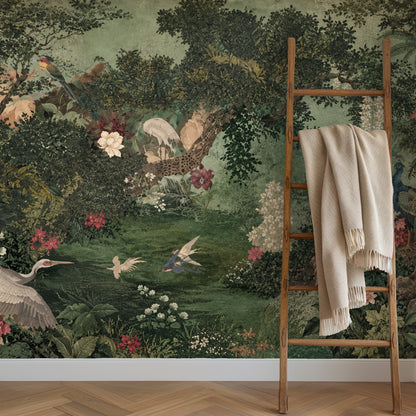 Bedroom close crop with a scalloped moss-green headboard in front of the mural, highlighting layered leaves and cream blossoms.