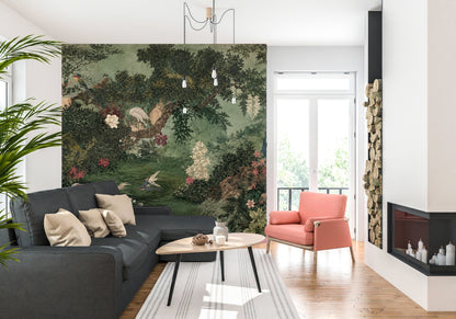 Full-width painterly scenic mural showing a moss-green pond, dense foliage, a peacock on a rock and cranes among flowering shrubs.