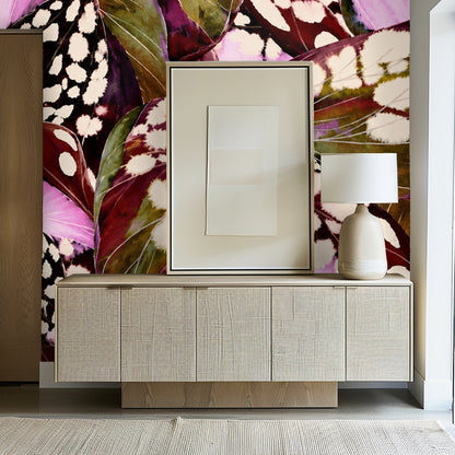 Living room vignette with orange sofa set against the burgundy and pink Begonia Nocturne mural