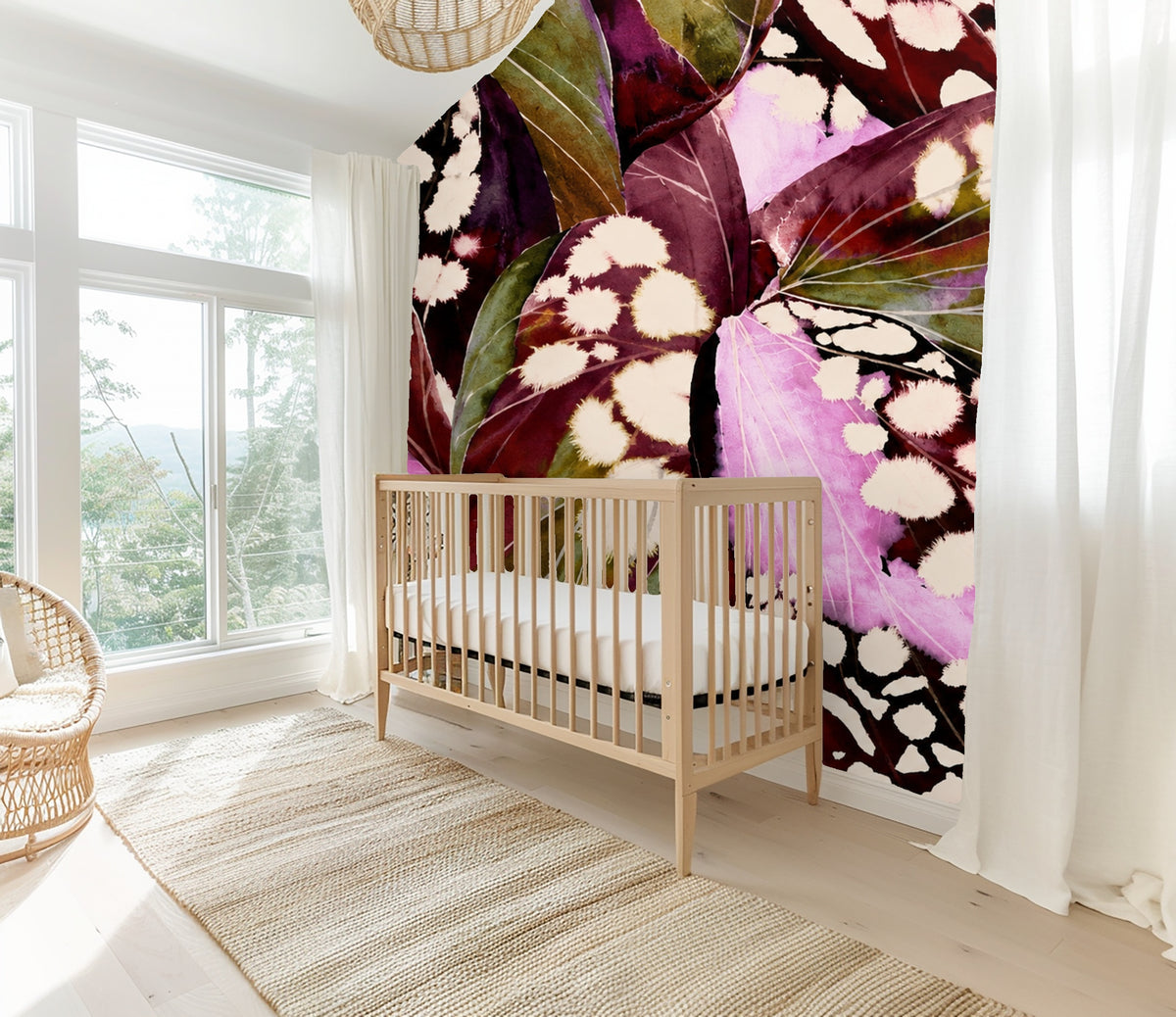 Bathroom detail showing wallpaper behind a towel ring, highlighting olive veins and cream spots on the leaves